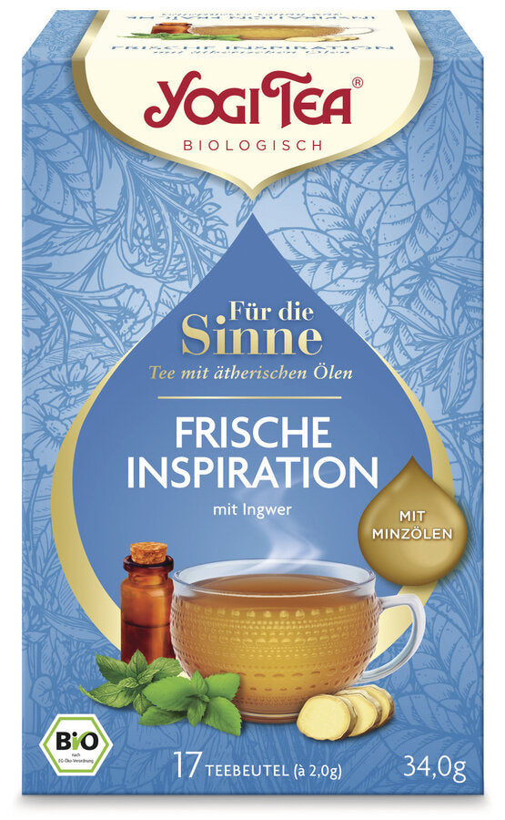 Eine Packung des 'Frische Inspiration' Tees von Yogi Tea aus der Reihe 'Für die Sinne'. Die Verpackung ist hellblau mit einem floralen Muster und zeigt eine Illustration einer Tasse Tee, umgeben von Minzblättern, Ingwer und einer kleinen Flasche ätherisches Öl. Oben steht in roter Schrift 'Yogi Tea' und darunter 'Biologisch'. Die Teesorte ist als 'Tee mit ätherischen Ölen, mit Ingwer' beschrieben. Ein goldener Tropfen auf der rechten Seite weist darauf hin, dass der Tee mit Minzölen ist.