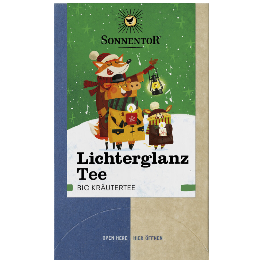 Sonnentor Lichterglanz Tee Bio-Kräutertee, Verpackungsvorderseite mit Wintermotiv und Tieren