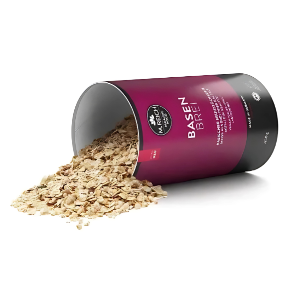 M. Reich Basenbrei – basischer Frühstücksbrei in Bio-Qualität, geöffnete 450 g Dose mit herausrieselndem Brei