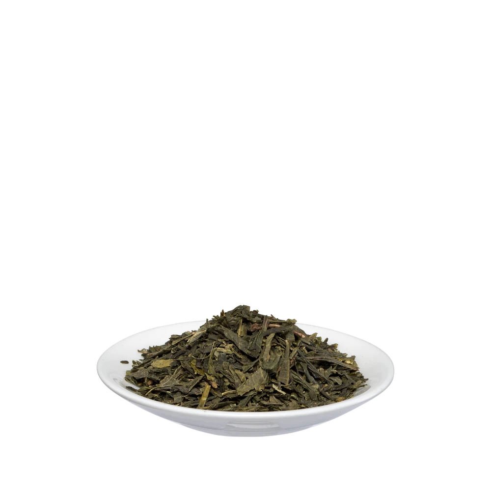 Lose Sencha-Blätter aus Schoenenberger Grüntee Bio in weißer Schale