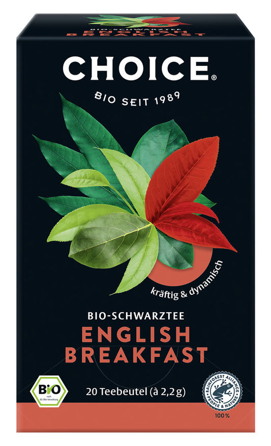 Das Bild zeigt eine schwarze Verpackung des Bio-Schwarztees "English Breakfast" der Marke Choice. Auf der Vorderseite sind grüne und rote Teeblätter abgebildet, darüber steht in weißer Schrift "CHOICE" und darunter "BIO SEIT 1989". Der Slogan "kräftig & dynamisch" ist in weißer Schrift auf rotem Hintergrund zu sehen. Unten auf der Verpackung steht "BIO-SCHWARZTEE ENGLISH BREAKFAST" in weißen und roten Buchstaben. Darunter befindet sich der Hinweis "20 Teebeutel (à 2,2 g)".