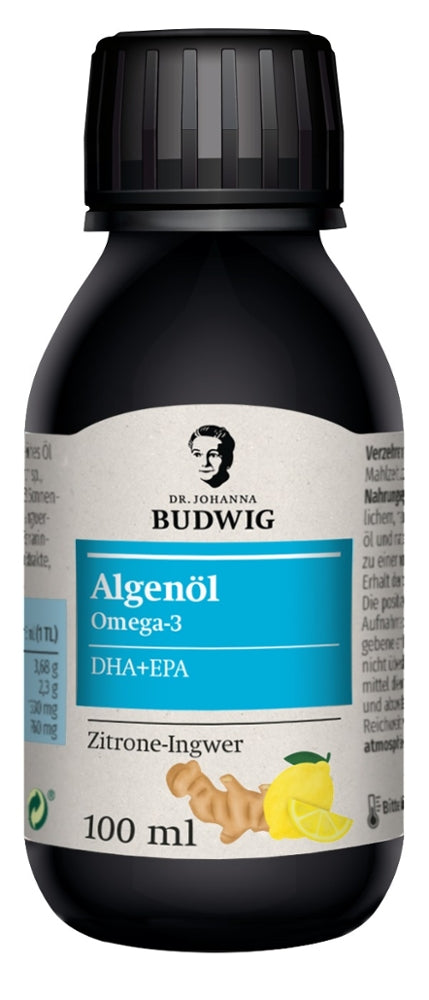 Dr. Johanna Budwig Algenöl Omega-3 mit DHA und EPA, Geschmacksrichtung Zitrone-Ingwer, 100 ml Flasche. Schwarze Flasche mit Schraubverschluss, blaues Etikett mit weißer und schwarzer Schrift sowie Abbildung von Zitrone und Ingwer.