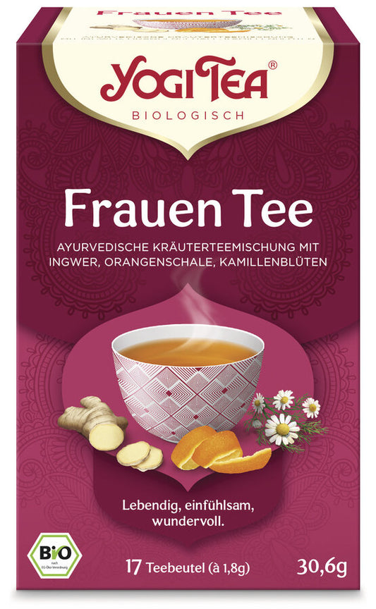 Eine Packung des 'Frauen Tee' von Yogi Tea. Die Verpackung ist dunkelrot und zeigt eine Illustration einer Tasse Tee mit einem geometrischen Muster, umgeben von Ingwer, Orangenschalen und Kamillenblüten. Oben steht in roter Schrift 'Yogi Tea' und darunter 'Biologisch'. Die Teesorte ist als 'Ayurvedische Kräuterteemischung mit Ingwer, Orangenschale, Kamillenblüten' beschrieben. Unten steht 'Lebendig, einfühlsam, wundervoll'. Es sind 17 Teebeutel à 1,8 g enthalten, insgesamt 30,6 g.