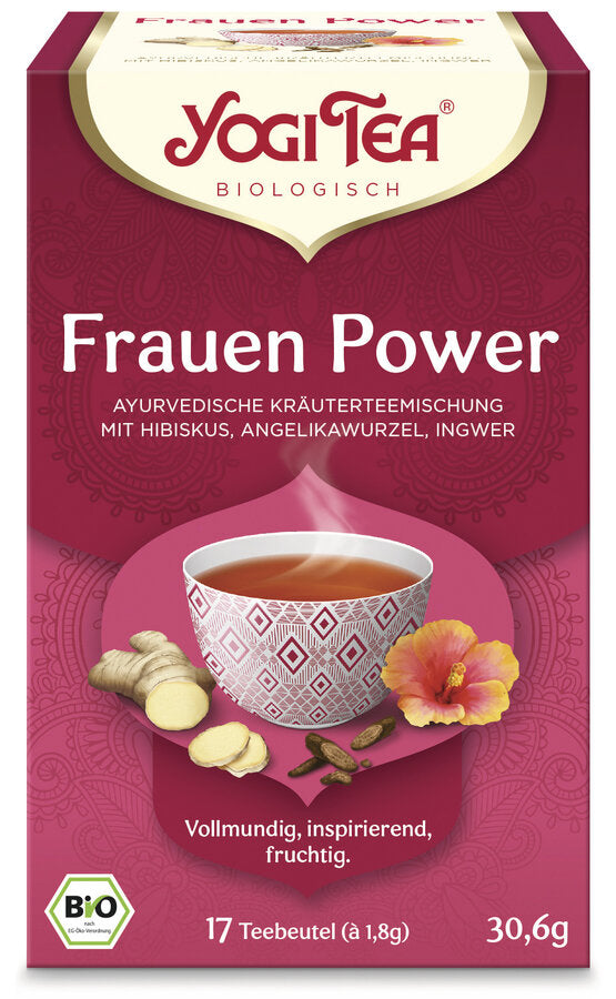 Eine Packung des 'Frauen Power' Tees von Yogi Tea. Die Verpackung ist rot und zeigt eine Illustration einer Tasse Tee mit einem geometrischen Muster, umgeben von Ingwer, Angelikawurzel und Hibiskusblüten. Oben steht in roter Schrift 'Yogi Tea' und darunter 'Biologisch'. Die Teesorte ist als 'Ayurvedische Kräuterteemischung mit Hibiskus, Angelikawurzel, Ingwer' beschrieben. Unten steht 'Vollmundig, inspirierend, fruchtig'. Es sind 17 Teebeutel à 1,8 g enthalten, insgesamt 30,6 g. Unten links ist das Bio-Sieg