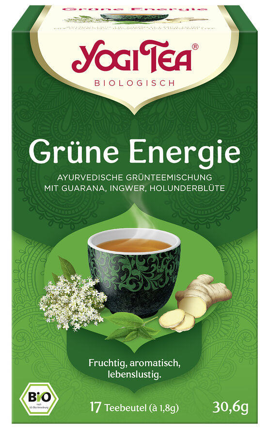 Eine Packung des 'Grüne Energie' Tees von Yogi Tea. Die Verpackung ist grün und zeigt eine Illustration einer Tasse Tee mit einem dekorativen Muster, umgeben von Holunderblüten, Ingwer und Guarana. Oben steht in roter Schrift 'Yogi Tea' und darunter 'Biologisch'. Die Teesorte ist als 'Ayurvedische Grünteemischung mit Guarana, Ingwer, Holunderblüte' beschrieben. Unten steht 'Fruchtig, aromatisch, lebenslustig'. Es sind 17 Teebeutel à 1,8 g enthalten, insgesamt 30,6 g. Unten links ist das Bio-Siegel.