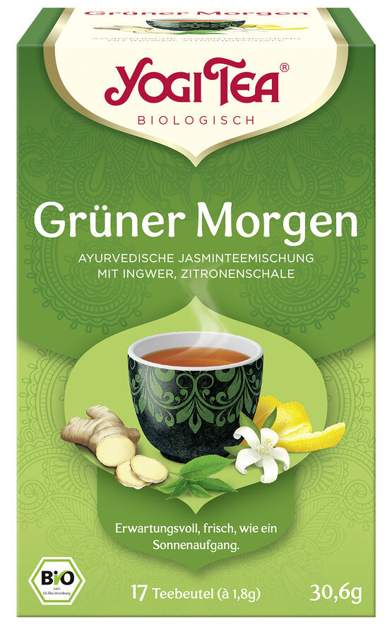 Eine Packung des 'Grüner Morgen' Tees von Yogi Tea. Die Verpackung ist grün und zeigt eine Illustration einer Tasse Tee mit einem dekorativen Muster, umgeben von Ingwer, Zitronenschalen und Jasminblüten. Oben steht in roter Schrift 'Yogi Tea' und darunter 'Biologisch'. Die Teesorte ist als 'Ayurvedische Jasminteemischung mit Ingwer, Zitronenschale' beschrieben. Unten steht 'Erwartungsvoll, frisch, wie ein Sonnenaufgang'. Es sind 17 Teebeutel à 1,8 g enthalten, insgesamt 30,6 g.