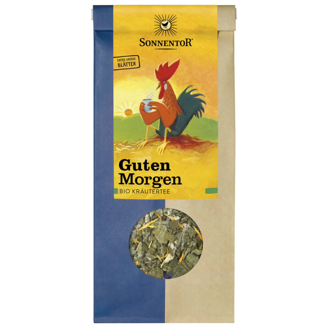 Sonnentor Guten Morgen Bio Kräutertee lose mit extra großen Blättern, bunte Verpackung mit Hahn-Motiv und Sichtfenster