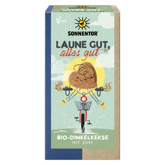 Sonnentor Bio-Dinkelkekse mit Zimt – Verpackung der veganen Kekse „Laune gut, alles gut“ mit fröhlichem Design und neuer Rezeptur