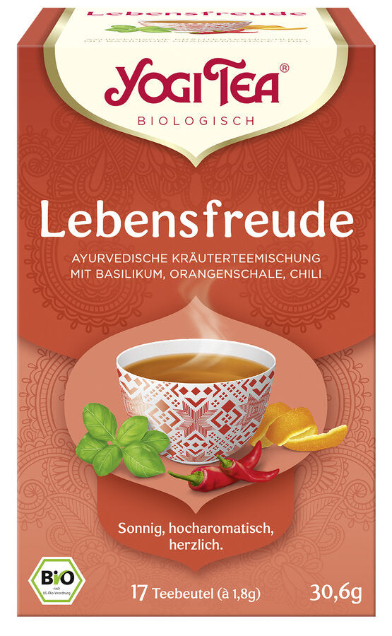 Eine Packung des 'Lebensfreude' Tees von Yogi Tea. Die Verpackung ist orange und zeigt eine Illustration einer Tasse Tee mit einem geometrischen Muster, umgeben von Basilikumblättern, Orangenschalen und Chilischoten. Oben steht in roter Schrift 'Yogi Tea' und darunter 'Biologisch'. Die Teesorte ist als 'Ayurvedische Kräuterteemischung mit Basilikum, Orangenschale, Chili' beschrieben. Unten steht 'Sonnig, hocharomatisch, herzlich'. Es sind 17 Teebeutel à 1,8 g enthalten, insgesamt 30,6 g.