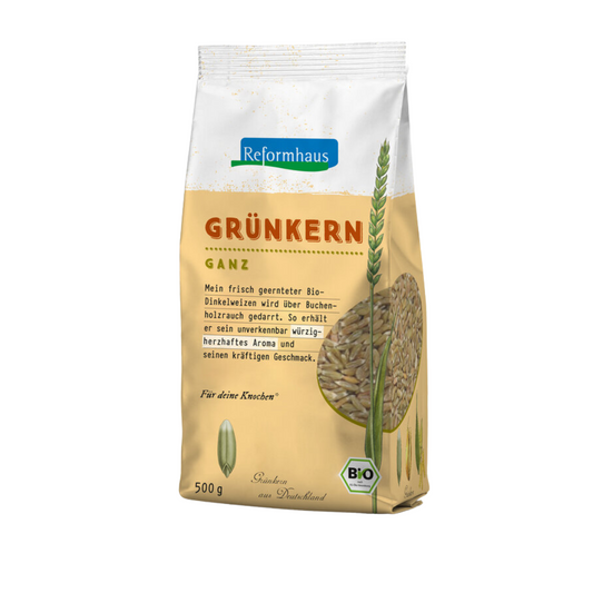 Reformhaus Bio Grünkern ganz – 500 g Packung mit Dinkelähre und Produktbeschreibung auf der Vorderseite