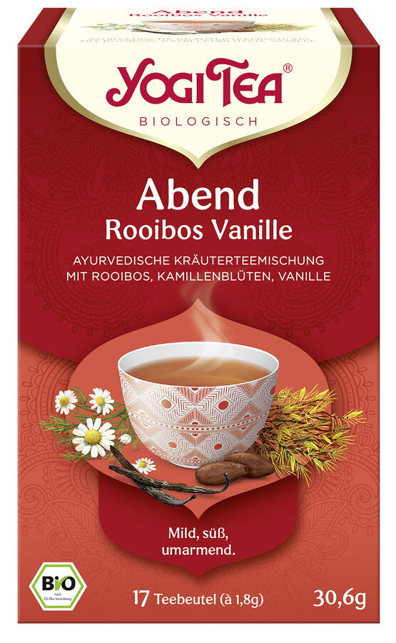 Eine Packung "Yogi Tea Abend Rooibos Vanille" von der Marke Yogi Tea. Auf der Vorderseite der Packung steht "Abend Rooibos Vanille" und "Ayurvedische Kräuterteemischung mit Rooibos, Kamillenblüten, Vanille". Das Etikett zeigt eine dampfende Tasse Tee, umgeben von Kamillenblüten, Vanilleschoten und Rooibospflanzen. Unten auf der Packung steht "Mild, süß, umarmend". Der Tee ist ein Bio-Produkt, wie durch das Bio-Siegel unten links angezeigt wird.