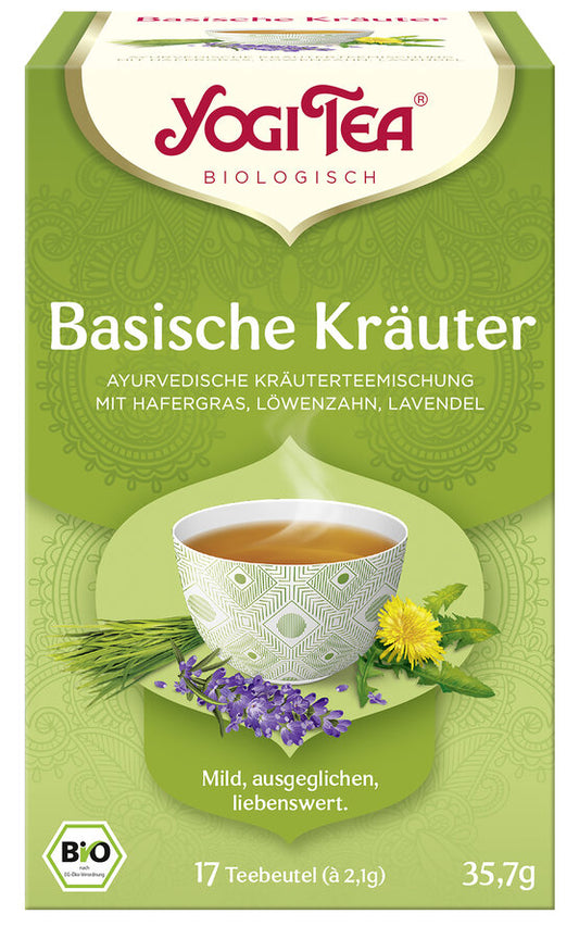 Eine Packung "Yogi Tea Basische Kräuter" von der Marke Yogi Tea. Auf der Vorderseite der Packung steht "Basische Kräuter" und "Ayurvedische Kräuterteemischung mit Hafergras, Löwenzahn, Lavendel". Das Etikett zeigt eine dampfende Tasse Tee, umgeben von Hafergras, Löwenzahnblüten und Lavendelblüten. Unten auf der Packung steht "Mild, ausgeglichen, liebenswert". Die Packung enthält 17 Teebeutel mit jeweils 2,1 g Tee, insgesamt 35,7 g. 